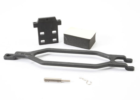 Traxxas extended battery hold down with hardware for secure battery mounting in RC vehicles, shown with metal brackets and screws.