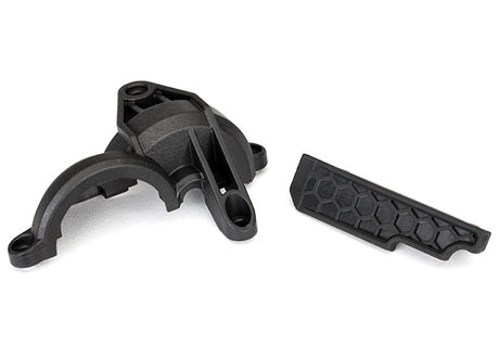 Traxxas rear gear cover for RC vehicle, black plastic with gear opening, designed to protect the rear gear assembly.