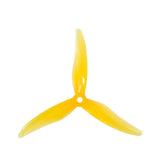 Two pairs of yellow Gemfan Hurricane 51477 3-blade drone propellers for quadcopters, shown from different angles.