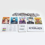 Coup card game by Indie Boards & Cards featuring a deck of cards and game components on a wooden surface.