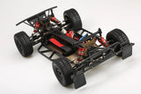 LC Racing EMB-SCHK 1/4 scale 4WD mini short course truck kit, showing assembled chassis and detailed components.