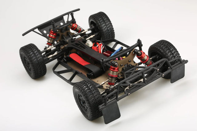 LC Racing EMB-SCHK 1/4 scale 4WD mini short course truck kit, showing assembled chassis and detailed components.