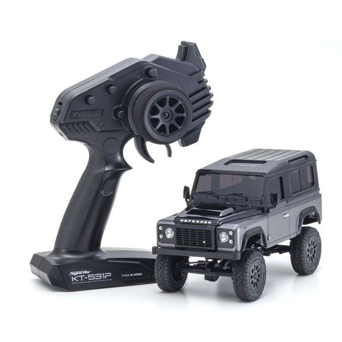 Kyosho Mini-Z MX-01 4x4 Land Rover Defender 90 RC car in gray and black, detailed exterior with realistic design.
