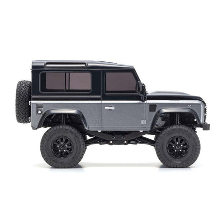 Kyosho Mini-Z MX-01 4x4 Land Rover Defender 90 RC car in gray and black, detailed interior and rugged exterior design.