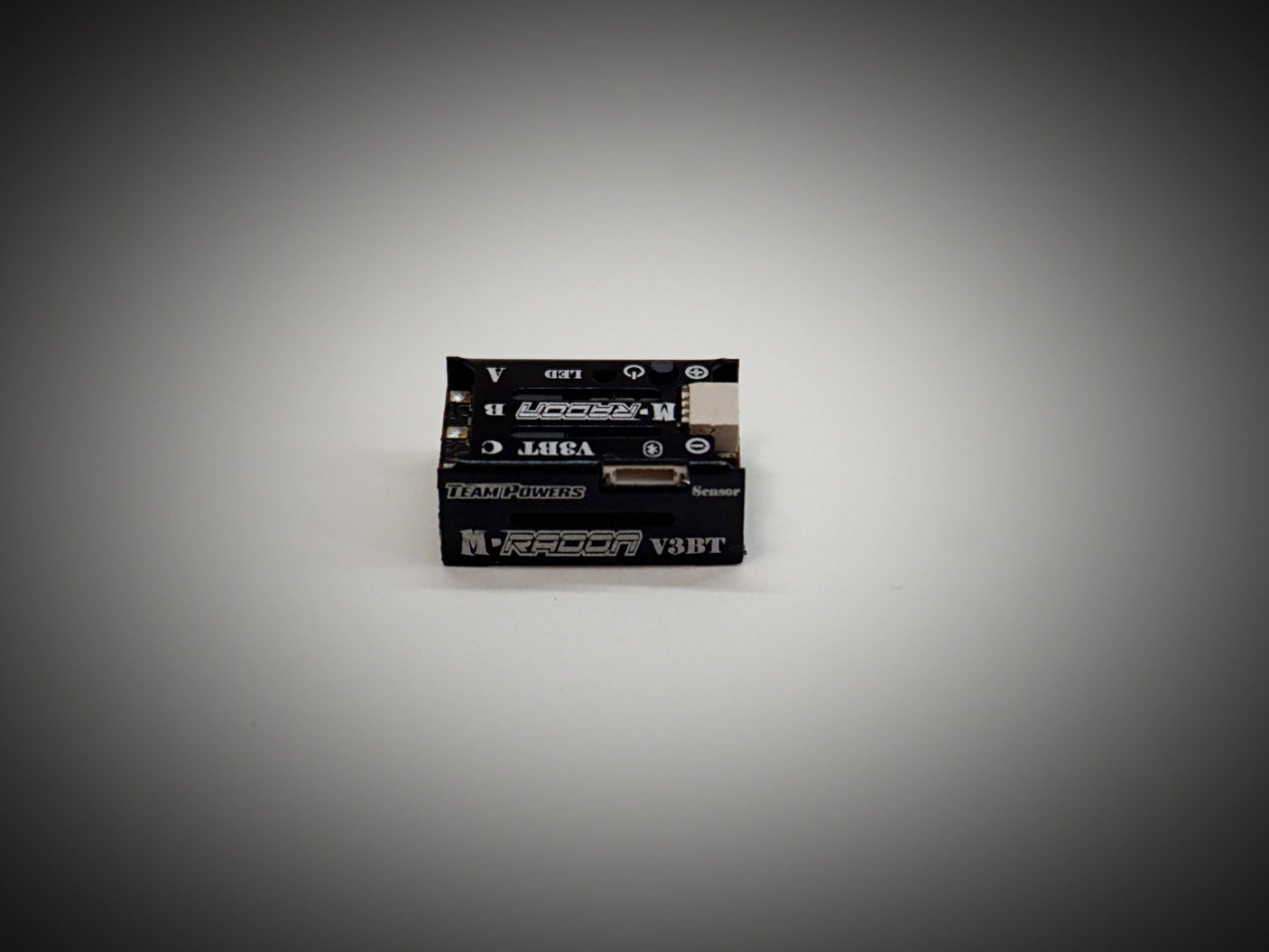 Team Powers M-Radon V3BT 30A Bluetooth ESC for RC cars, showing the compact electronic speed controller with Bluetooth connectivity.