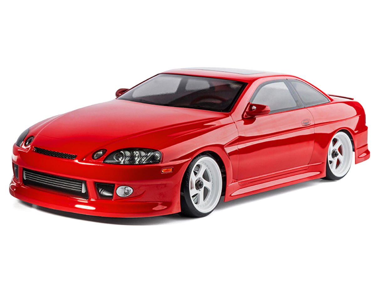 Red MST RMX 2.5 1/10 2WD brushless RTR drift car with sleek design, detailed body, and racing wheels.