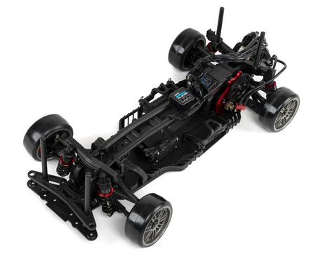 Red MST RMX 2.5 1/10 2WD brushless RTR drift car with detailed body and large tires, ready for high-performance drifting.