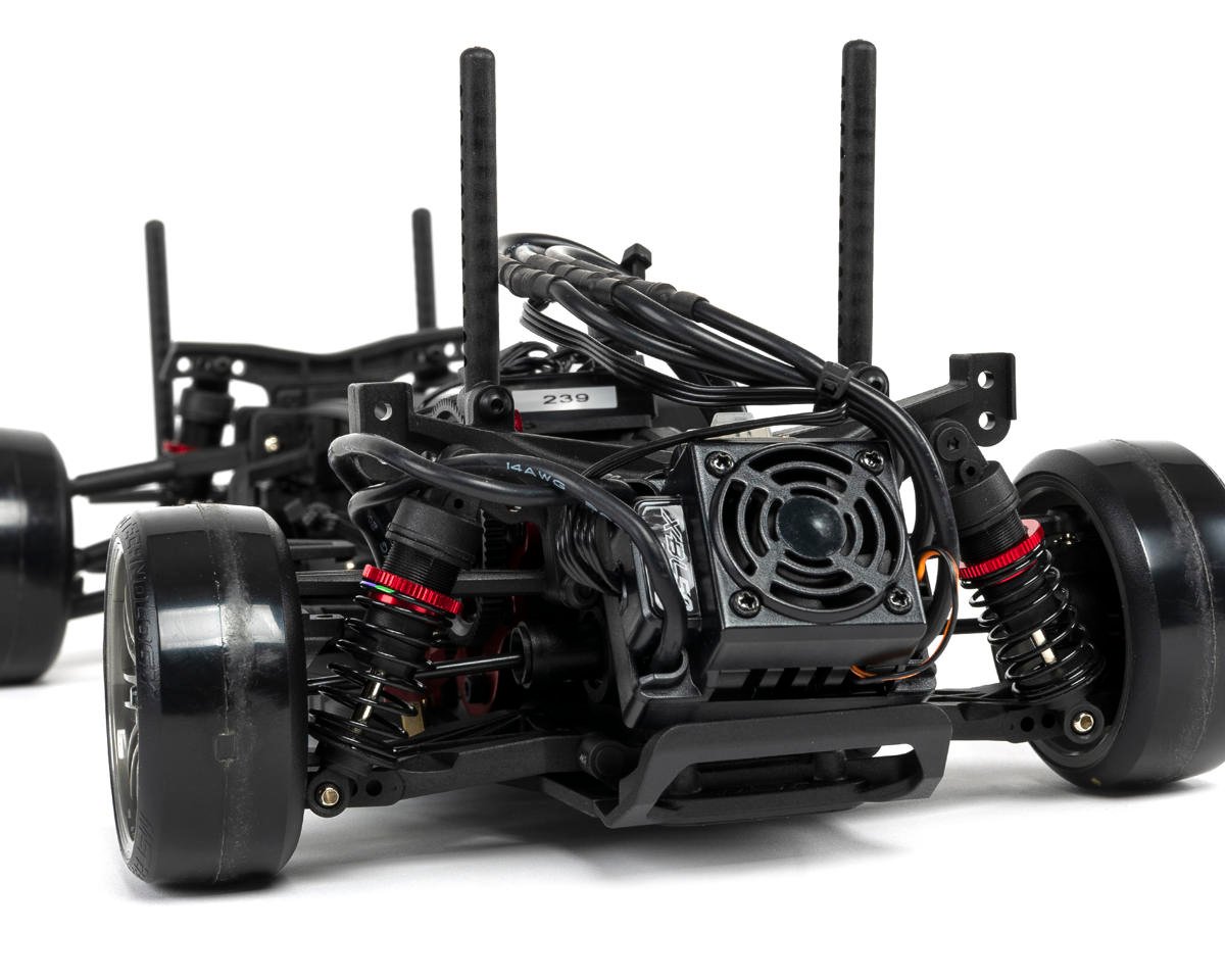 Red MST RMX 2.5 1/10 2WD brushless RTR drift car with detailed body and wheels, ready for high-performance drifting.