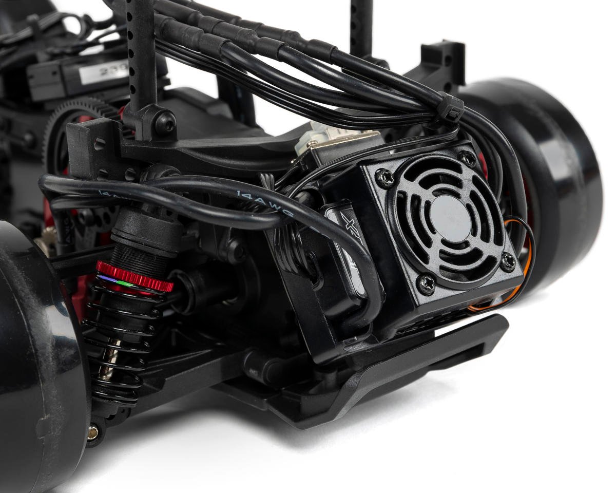 Red MST RMX 2.5 1/10 2WD brushless RTR drift car with detailed body and racing tires, ready for high-performance drifting.