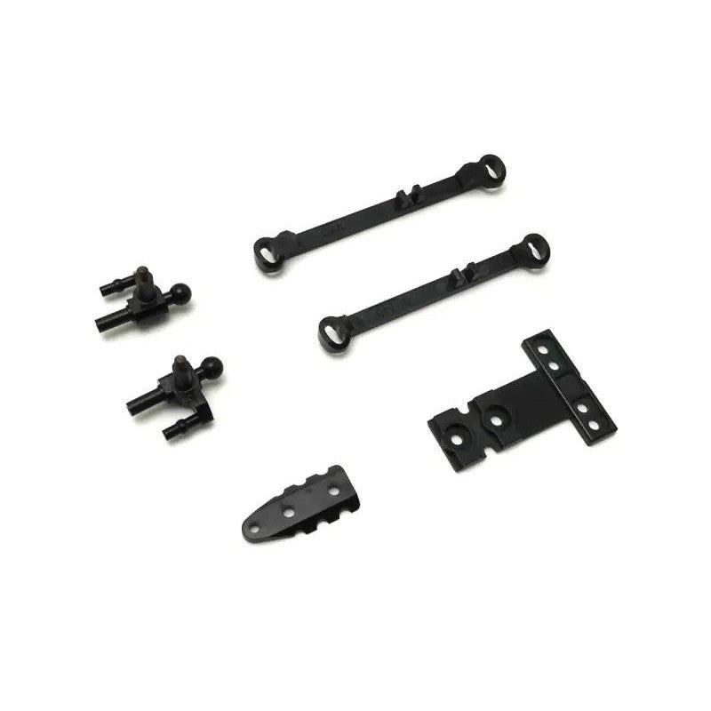 Kyosho Mini-Z MR-04 suspension small parts for RC car, close-up of tiny components for model car maintenance.