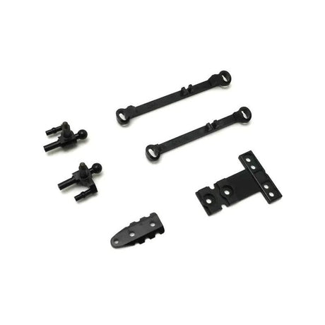 Kyosho Mini-Z MR-04 suspension small parts for RC car, close-up of tiny components for model car maintenance.
