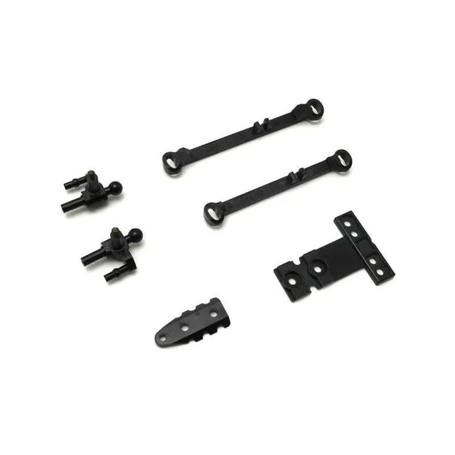 Kyosho Mini-Z MR-04 suspension small parts for RC car, close-up of tiny components for model car maintenance.