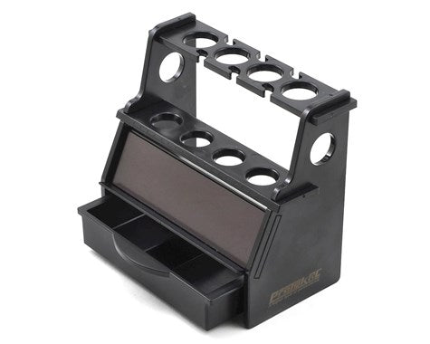 ProTek RC shock stand for 1/10 and 1/8 scale RC cars, black plastic with adjustable supports, used for maintenance and setup.