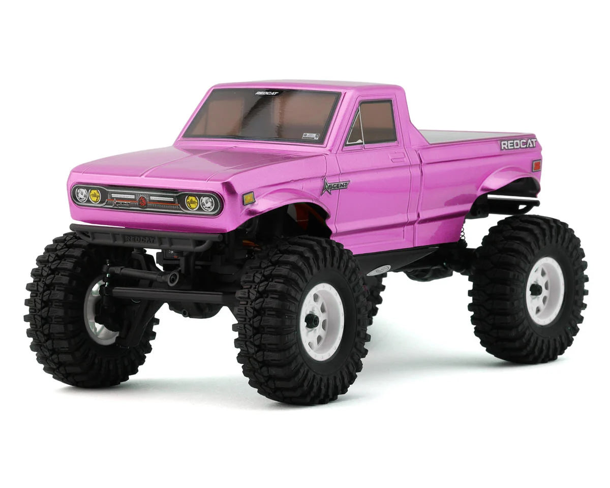 Redcat Ascent-18 RC rock crawler with red chassis, large tires, and detailed suspension system for off-road adventures.