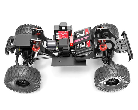 Redcat Ascent-18 1/18 scale 4WD RTR brushless rock crawler on rugged terrain with detailed red and black body design.
