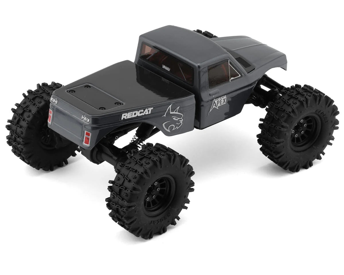 Redcat Ascent-18 Apex 1/18 scale 4WD RC crawler on rocky terrain, showcasing its compact design and off-road capabilities.