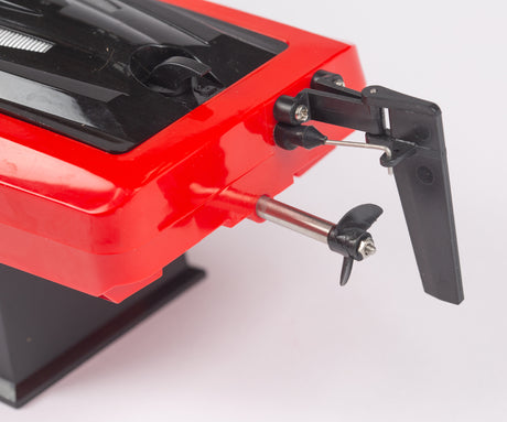 Rage RC SuperCat MX electric micro RTR boat racing on water, featuring sleek design and vibrant colors.
