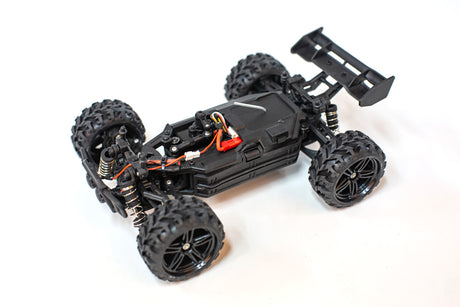 Mini Trek 1/24 RTR Truggy by Rage RC, yellow and black off-road RC vehicle with rugged tires and detailed body design.