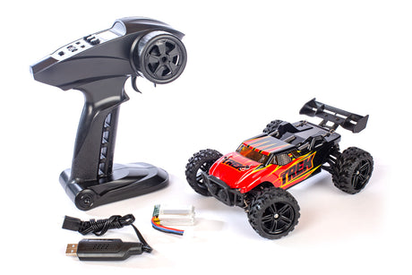 Rage RC Mini Trek 1/24 RTR Truggy off-road RC vehicle on dirt track, showcasing its compact design and rugged tires.