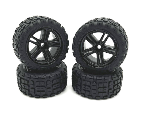 Four Rage RC Mini Trek MT wheels and tires for RC trucks, showing black wheels with rugged tires for off-road driving.