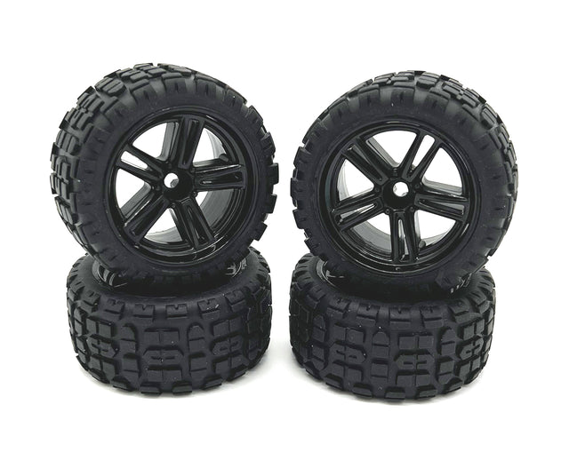 Four Rage RC Mini Trek MT wheels and tires for RC trucks, showing black wheels with rugged tires for off-road driving.