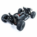 Tekno SCT410 2.0 1/10th scale 4x4 short course truck kit front-left angle view showing chassis and suspension details.