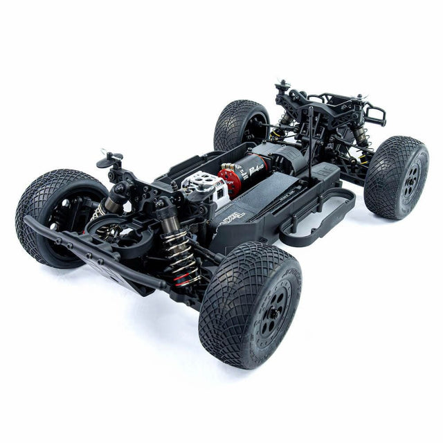 Tekno SCT410 2.0 1/10th scale 4x4 short course truck kit front-left angle view showing chassis and suspension details.