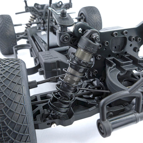 Tekno SCT410 2.0 1/10th scale 4x4 short course truck kit with top shock mount angle and suspension components.