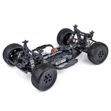 Tekno SCT410SL 1/10th scale 4x4 lightweight short course RC truck kit, front-left elevated view showing body and wheels.