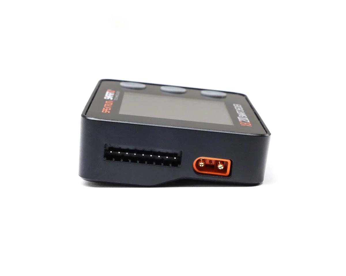 Spektrum RC XBC200 Smart Battery Checker and Servo Tester showing digital display and battery testing ports.