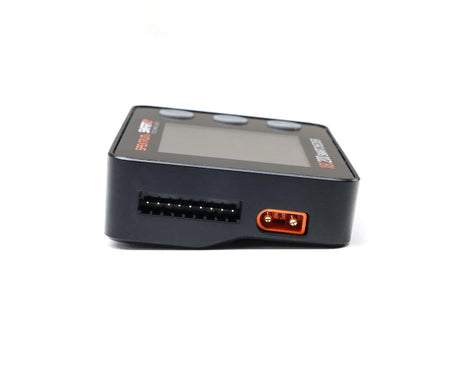 Spektrum RC XBC200 Smart Battery Checker and Servo Tester showing digital display and battery testing ports.