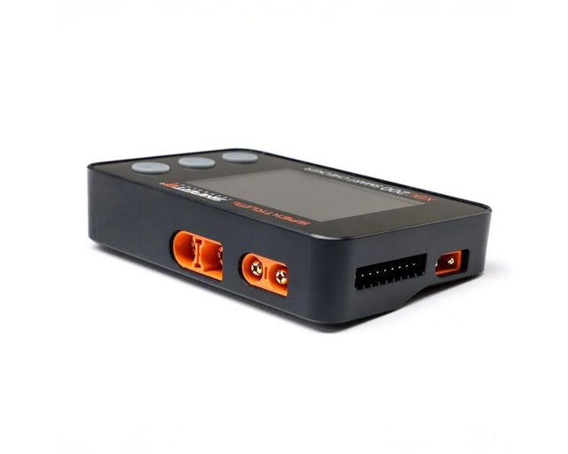 Spektrum RC XBC200 Smart Battery Checker and Servo Tester showing digital display and device buttons.