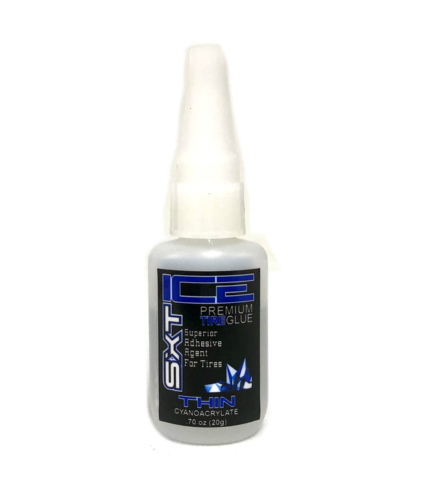 Close-up of SXT Ice Tire Glue bottle showing the label and applicator tip for winter tire repair and adhesion.
