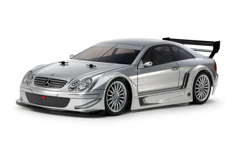 Tamiya TT-02 2002 Mercedes-Benz CLK AMG model kit showing detailed scale car parts and packaging.