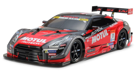 Tamiya TT-02 Motul Autech GT-R RC car kit with detailed body and chassis components for hobby racing enthusiasts