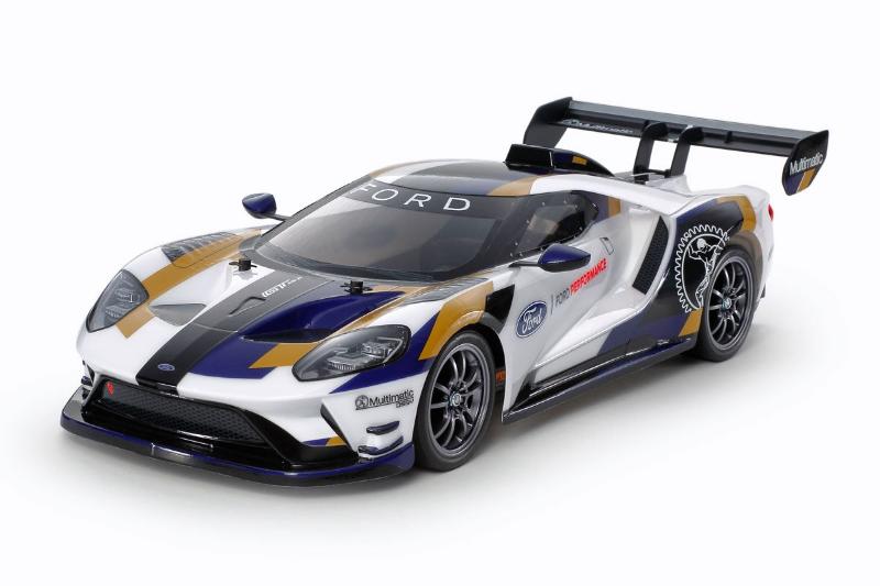 Tamiya TT-02 2020 Ford GT MK II model car kit with detailed plastic parts and assembly components.