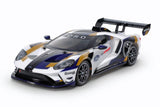 Tamiya TT-02 2020 Ford GT MK II model car kit with detailed plastic parts and assembly components.