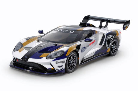 Tamiya TT-02 2020 Ford GT MK II model car kit with detailed plastic parts and assembly components.