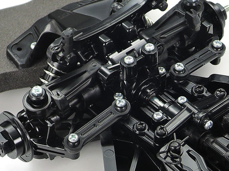 Tamiya TT-02 RC Toyota Supra kit with detailed body shell and components, ready for assembly and customization.