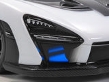 Tamiya TT-02 McLaren Senna RC car kit with detailed body and components, ready for assembly and customization.