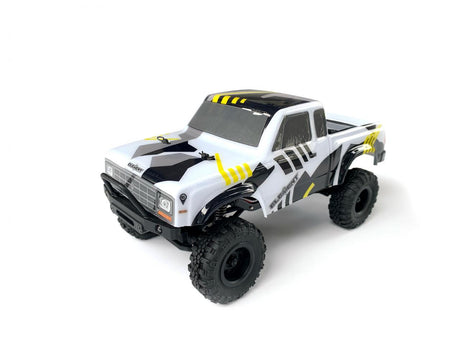 Black and yellow Element RC Enduro24 Sendero 1/24 RTR crawler with detailed chassis and off-road tires.