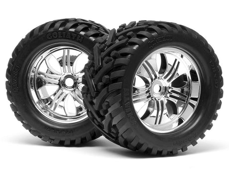 HPI Racing Goliath RC car tires mounted on chrome 178x97mm Tremor wheels, showing detailed tread and shiny chrome finish.