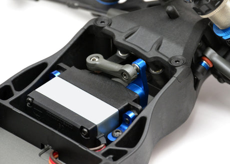 Exotek Racing AE Heavy Duty Servo Horn made of 7075 aluminum for RC car upgrades, shown in black with mounting holes visible.