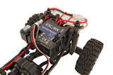Element RC Enduro24 Sendero 1/24 RTR crawler in black and yellow, showing the compact RC car with detailed wheels and body.