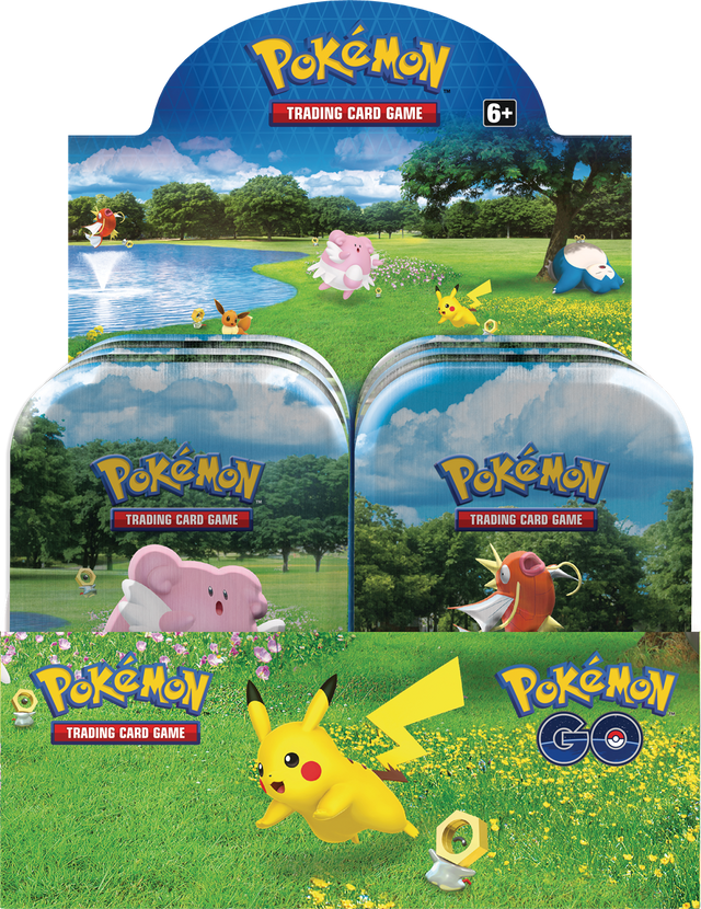 Assorted Pokémon GO Mini Tins with Pokémon trading cards displayed, featuring colorful tins and card packs from the Pokémon brand.