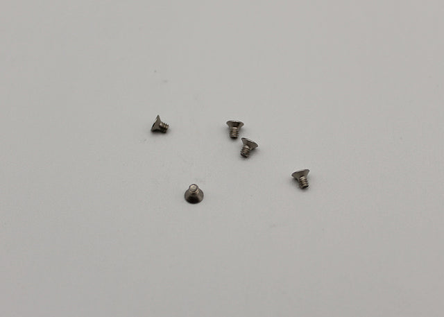 Reflex Racing RX28-024 M2x3mm countersunk screws for RC car parts, shown in close-up with shiny metal finish.