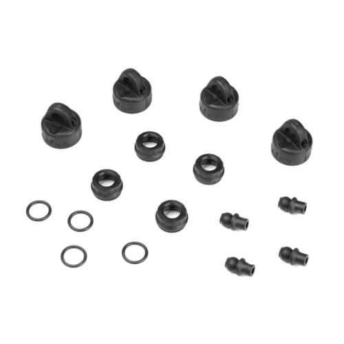 Tekno RC Car shock and cartridge cap and bushing set, TKR6712, showing various small suspension components.