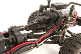 Element RC Enduro24 Sendero 1/24 RTR crawler with black and yellow body, detailed transmission and rugged design.