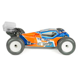 Tekno TKR7202 ET410.2 1/10th scale 4WD electric RC truggy kit with detailed chassis and vibrant orange and black body design.