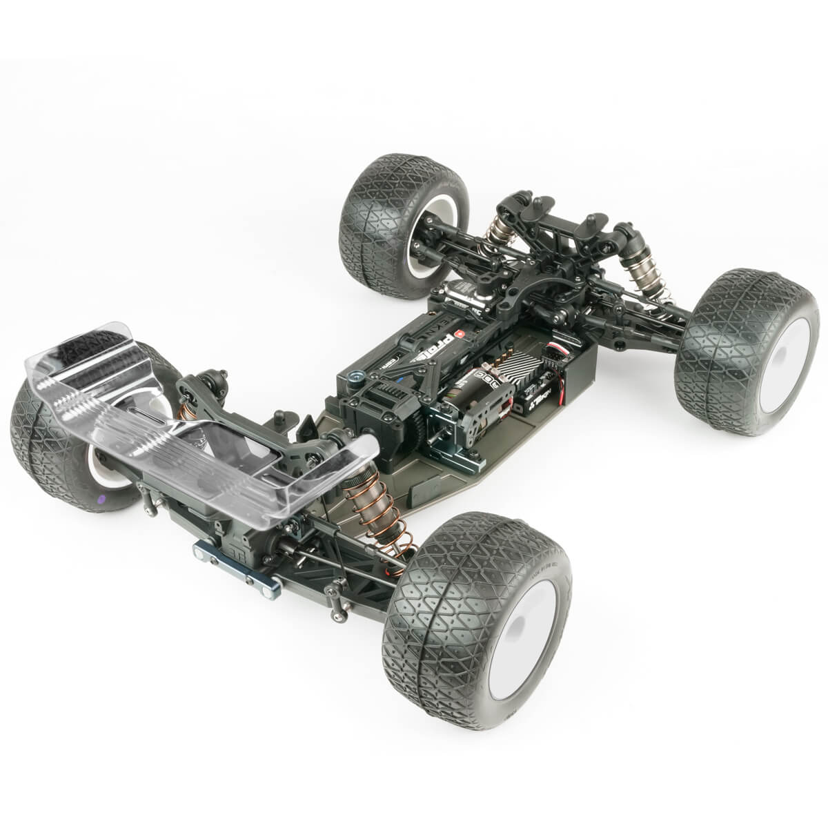 Tekno TKR7202 ET410.2 1/10th scale 4WD electric RC truggy kit on a track, showcasing its detailed chassis and off-road tires.